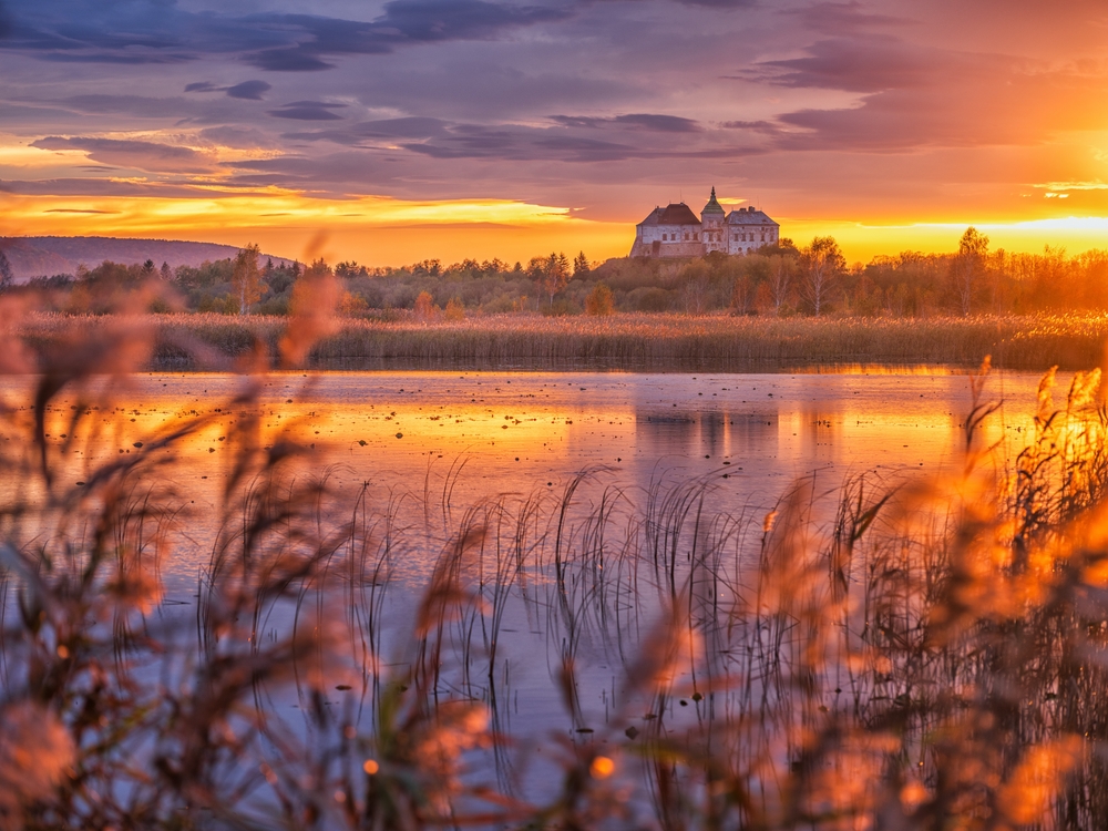 Castle on a lake at sunset