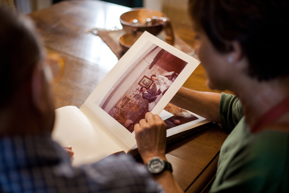 family looking at photo book