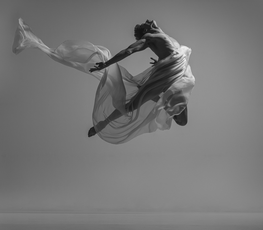 male ballet dancer dancing with fabric