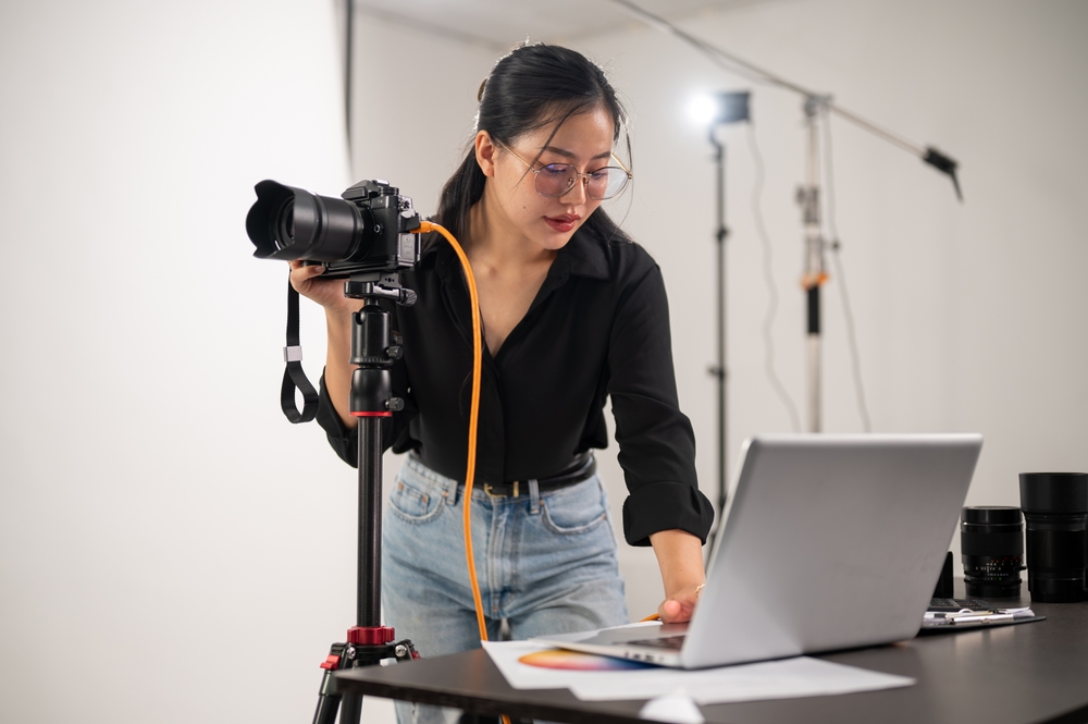 photographer checking images on her laptop computer