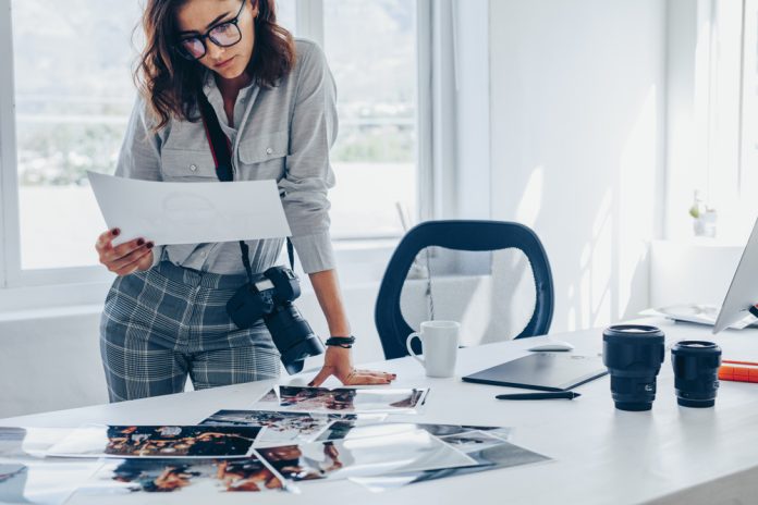 photographer checking prints