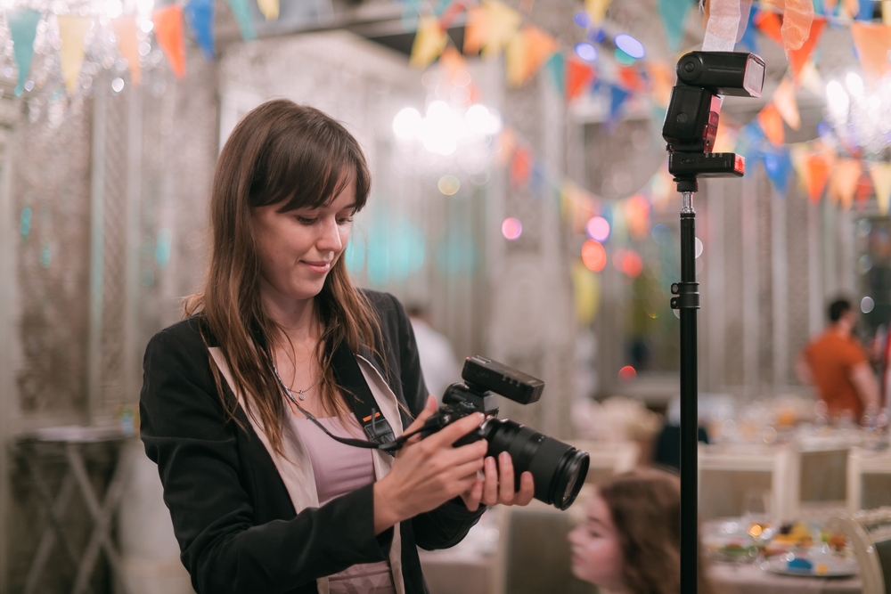 professional photographer with a camera and a flash