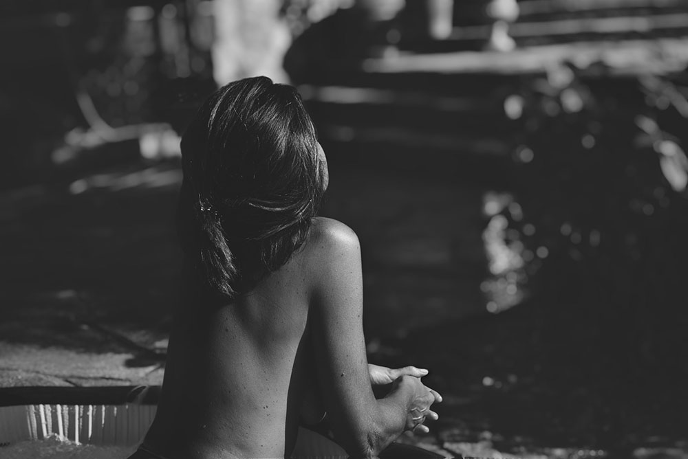 topless woman in a pool