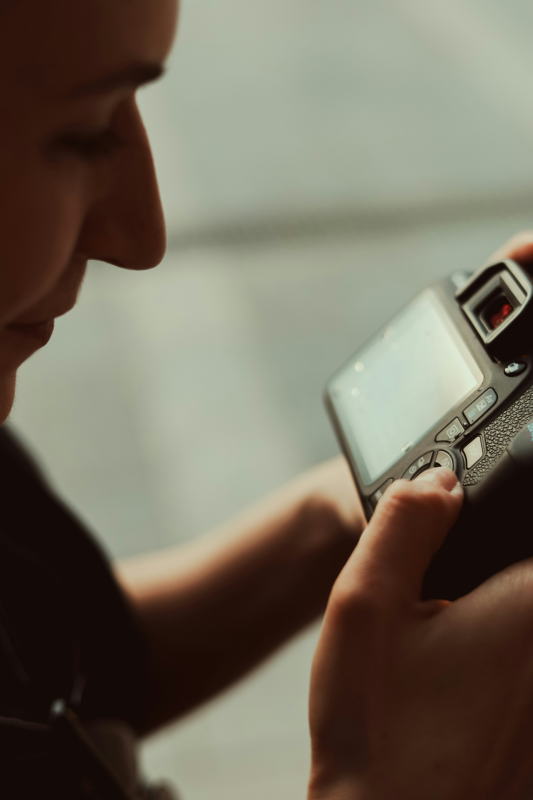 Man looking at back of a camera